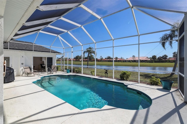 outdoor pool featuring a lanai, a grill, a water view, and a patio