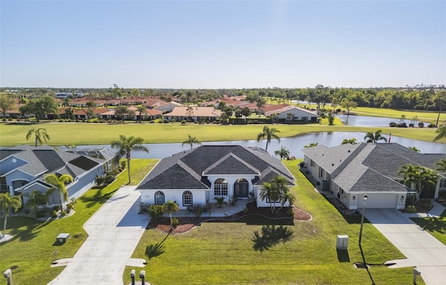 aerial view featuring a residential view and a water view