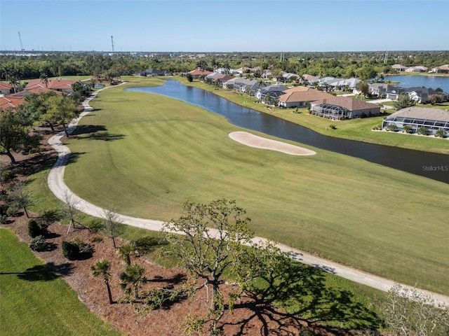 bird's eye view featuring a residential view, view of golf course, and a water view