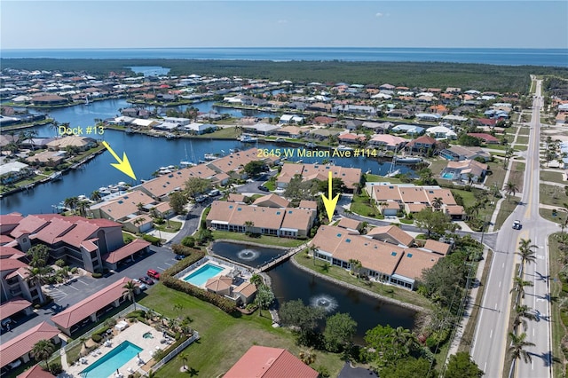 bird's eye view with a water view and a residential view