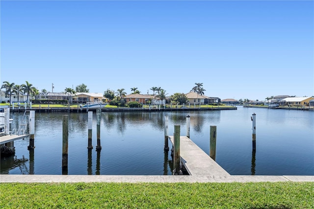 view of dock featuring a water view and a residential view