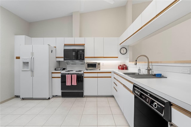 kitchen with light tile patterned floors, light countertops, black appliances, white cabinetry, and a sink