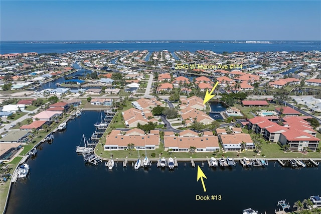 aerial view with a water view and a residential view