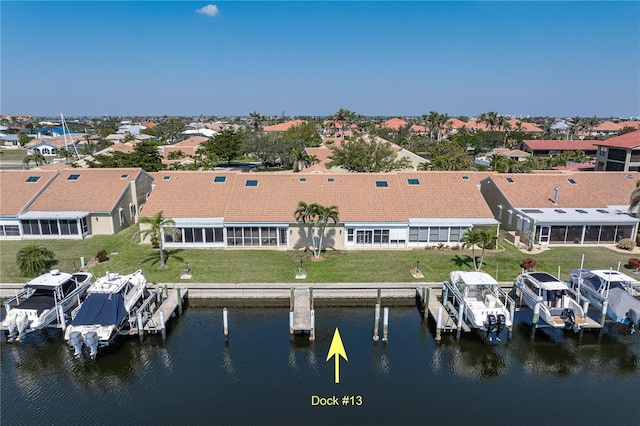 aerial view with a water view and a residential view