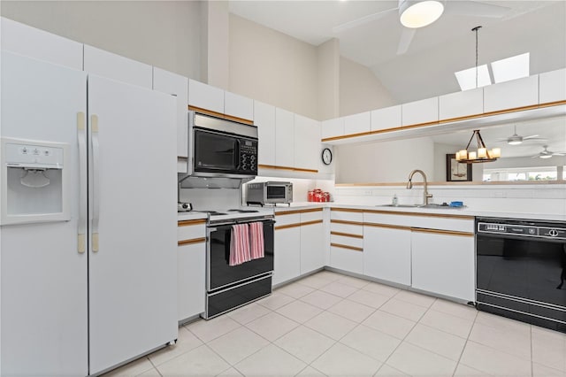 kitchen featuring black dishwasher, ceiling fan, white fridge with ice dispenser, a sink, and range with electric stovetop