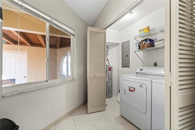 washroom with laundry area, light tile patterned floors, electric panel, electric water heater, and separate washer and dryer