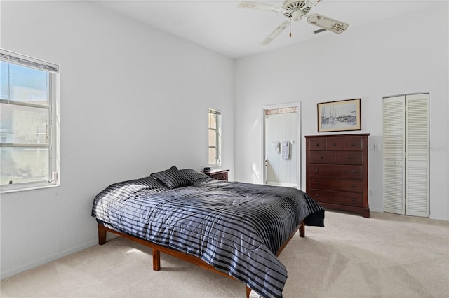 bedroom with carpet floors, ceiling fan, and a closet