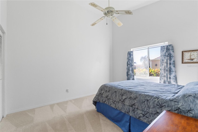 bedroom with a ceiling fan, carpet, and baseboards