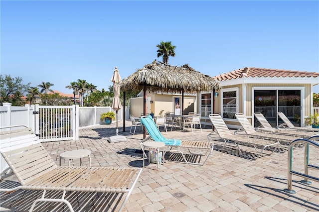 view of patio with fence and outdoor dining area