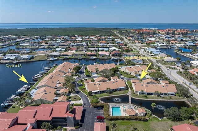 aerial view featuring a water view and a residential view