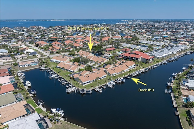 birds eye view of property featuring a residential view and a water view