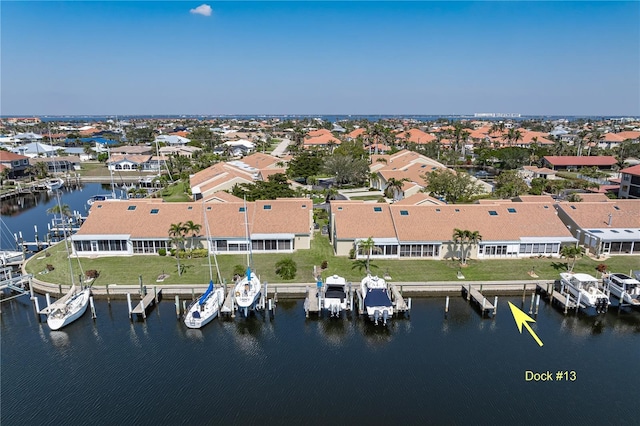 aerial view with a residential view and a water view