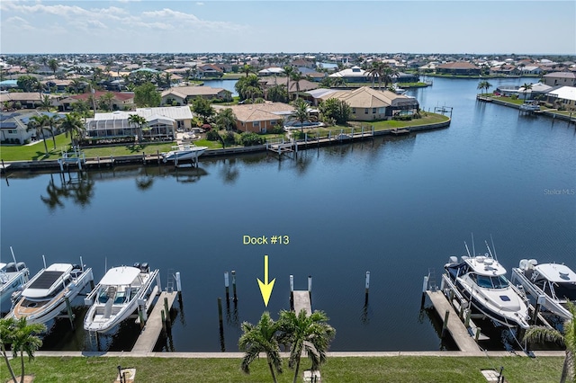 aerial view with a residential view and a water view