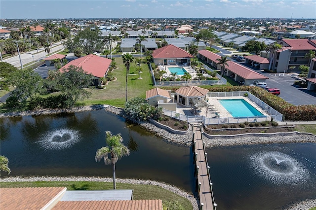 bird's eye view featuring a residential view and a water view