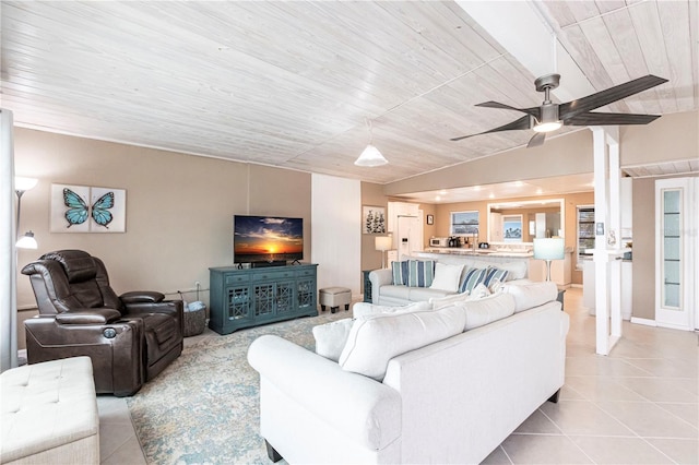 living room featuring tile patterned floors, wooden ceiling, a ceiling fan, and vaulted ceiling