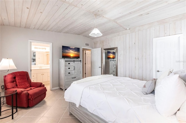 bedroom with visible vents, connected bathroom, lofted ceiling, light tile patterned floors, and wooden ceiling