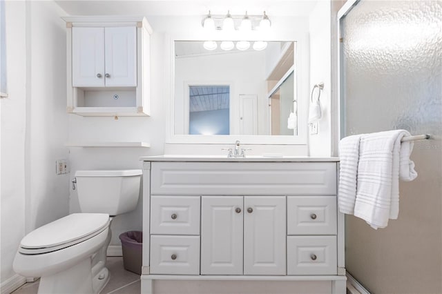 full bath featuring vanity, toilet, and a stall shower