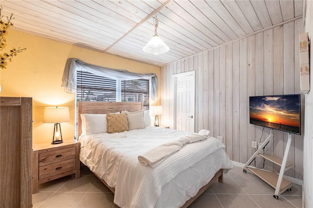 bedroom with light tile patterned floors, wood walls, and wood ceiling