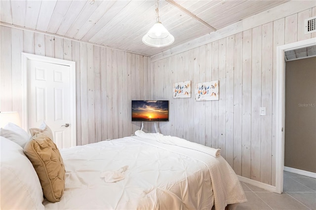 tiled bedroom with wooden walls and baseboards