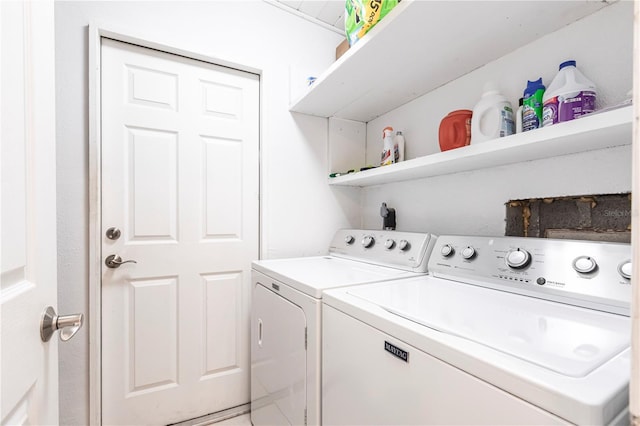 laundry area featuring washer and clothes dryer and laundry area