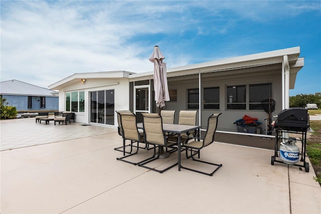 exterior space with outdoor dining area and a patio area