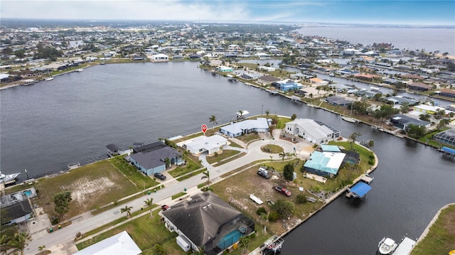 aerial view featuring a residential view and a water view