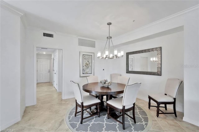 dining room featuring baseboards, visible vents, and ornamental molding