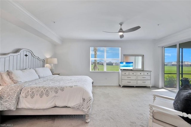 carpeted bedroom with crown molding, a ceiling fan, and access to outside