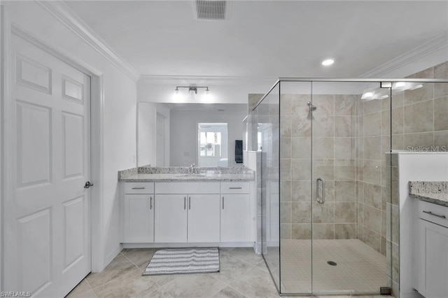 bathroom featuring visible vents, a stall shower, vanity, and ornamental molding