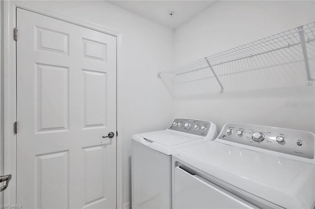 laundry room featuring laundry area and washer and clothes dryer