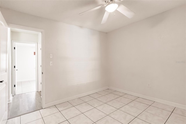 unfurnished room with baseboards and ceiling fan