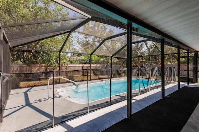 view of pool featuring a patio area, a fenced backyard, a fenced in pool, and a lanai