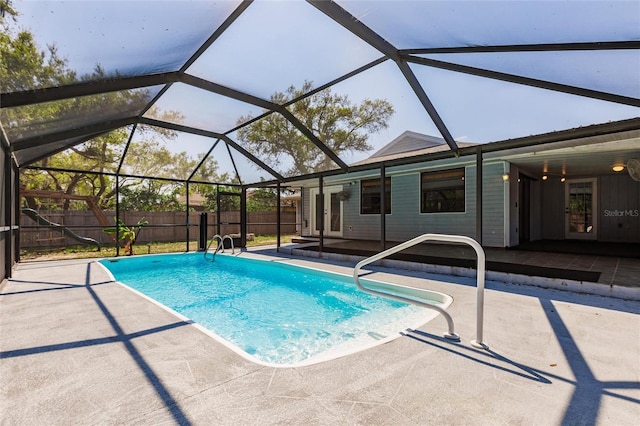 view of pool featuring a fenced in pool, a fenced backyard, french doors, a lanai, and a patio area