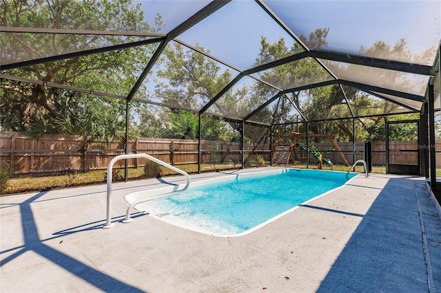 view of swimming pool with a patio area, a fenced backyard, a fenced in pool, and a lanai