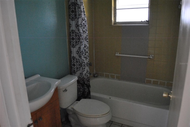 full bath with toilet, tile patterned flooring, shower / bath combo, and vanity