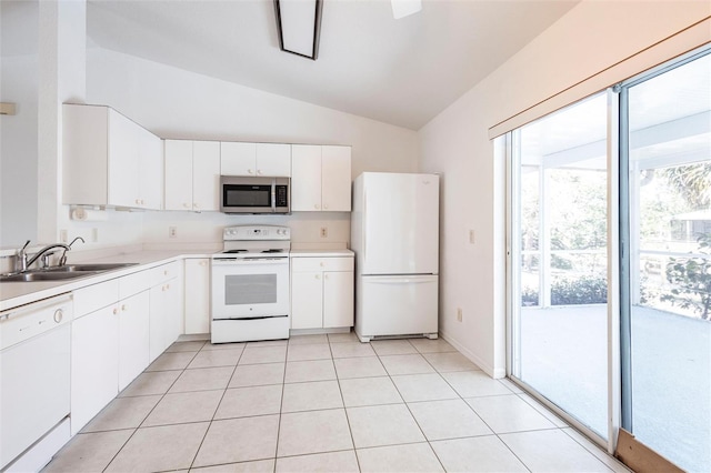 3436 Discovery Dr, Punta Gorda, FL 33983 - kitchen featuring white cabinets, lofted ceiling, light countertops, a sink, and white appliances