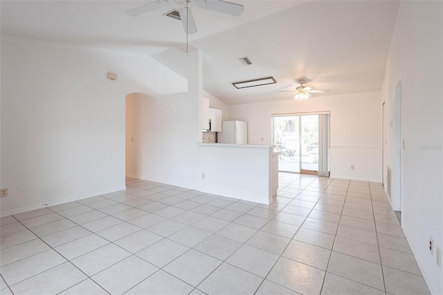 3436 Discovery Dr, Punta Gorda, FL 33983 - unfurnished room with arched walkways, lofted ceiling, a ceiling fan, and light tile patterned floors