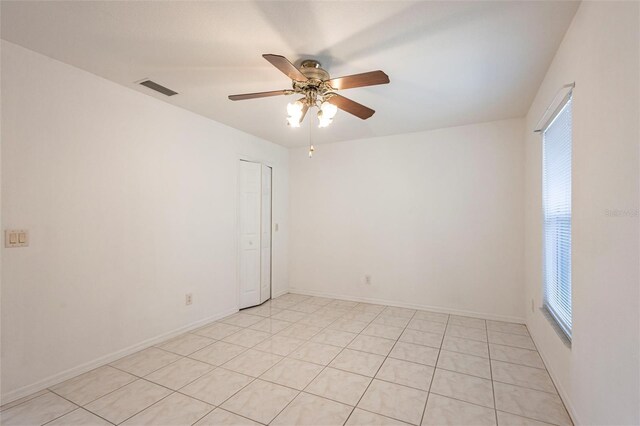 3436 Discovery Dr, Punta Gorda, FL 33983 - spare room with light tile patterned floors, baseboards, visible vents, and ceiling fan