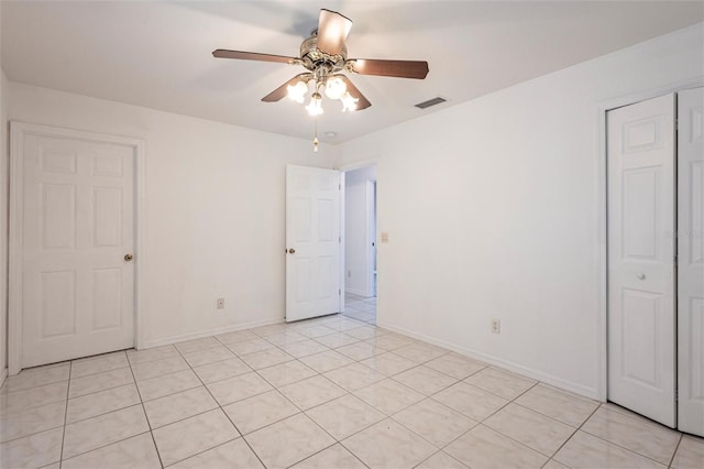 3436 Discovery Dr, Punta Gorda, FL 33983 - unfurnished bedroom with ceiling fan, baseboards, visible vents, and light tile patterned floors