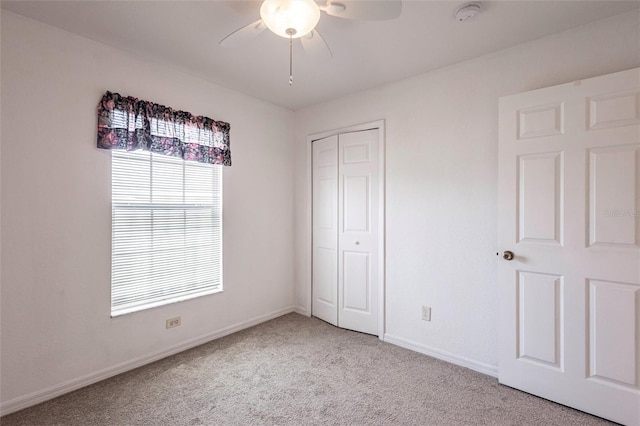 3436 Discovery Dr, Punta Gorda, FL 33983 - unfurnished bedroom with a closet, carpet flooring, baseboards, and a ceiling fan