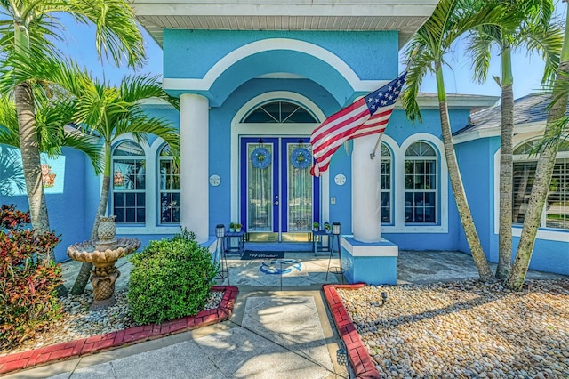 doorway to property with stucco siding