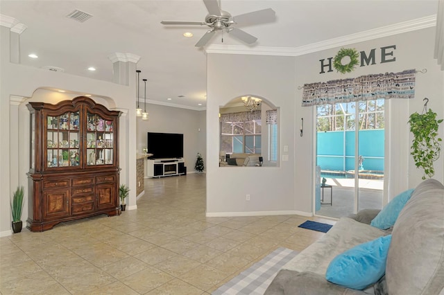 living area featuring visible vents, a ceiling fan, crown molding, and baseboards