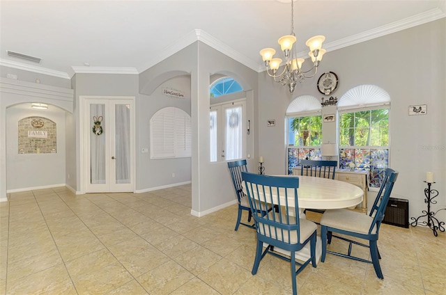 dining room with visible vents, ornamental molding, french doors, an inviting chandelier, and baseboards