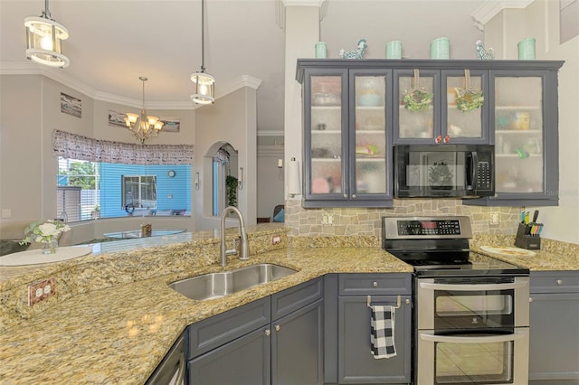 kitchen featuring range with two ovens, gray cabinets, black microwave, and a sink