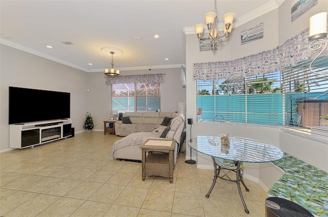 living area featuring an inviting chandelier, crown molding, and baseboards