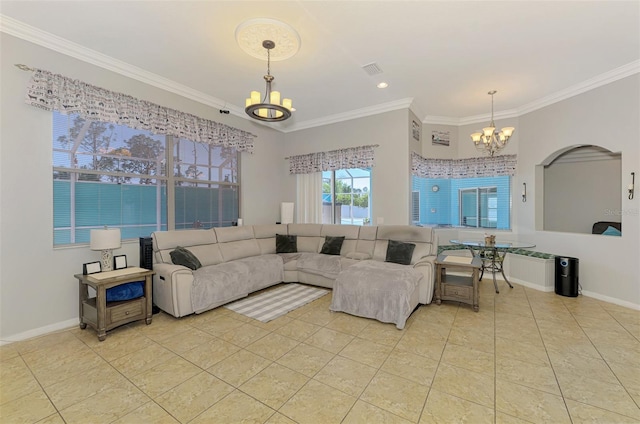 living area with an inviting chandelier, light tile patterned flooring, crown molding, and baseboards