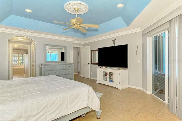 tiled bedroom featuring baseboards, recessed lighting, arched walkways, crown molding, and a raised ceiling