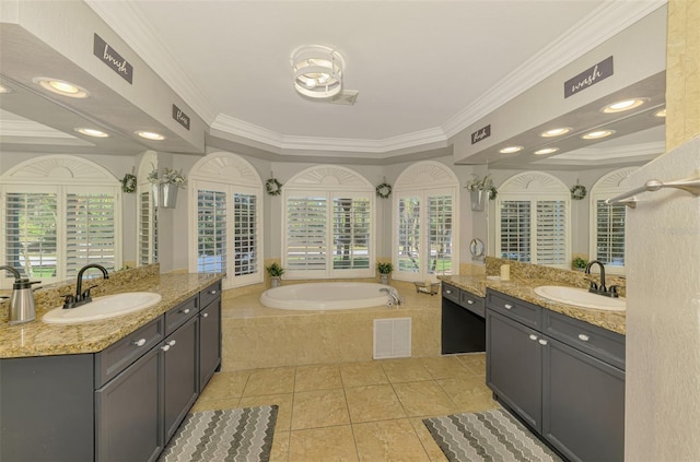 bathroom with ornamental molding, visible vents, and a sink