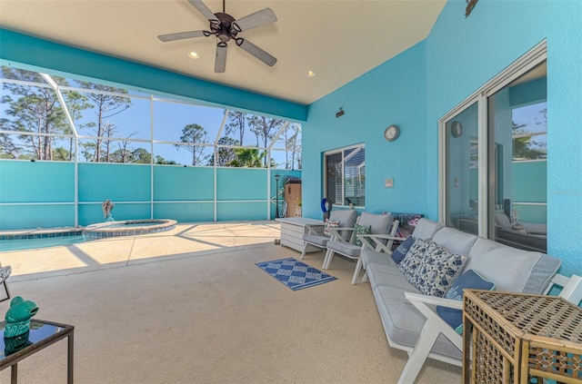 view of patio / terrace featuring glass enclosure, an outdoor hangout area, a ceiling fan, and a pool with connected hot tub