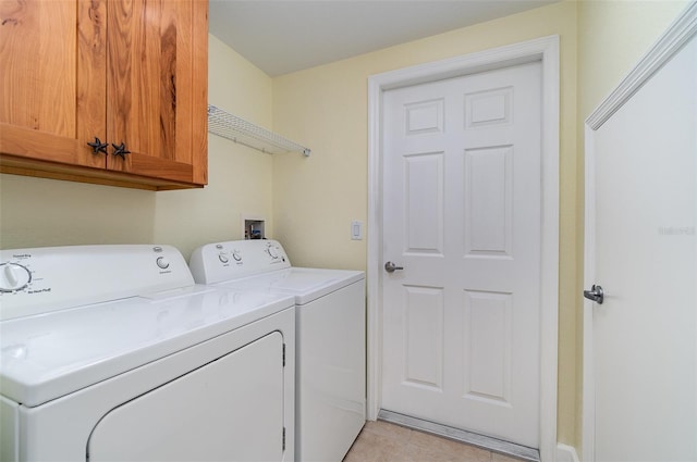 laundry area featuring cabinet space and independent washer and dryer